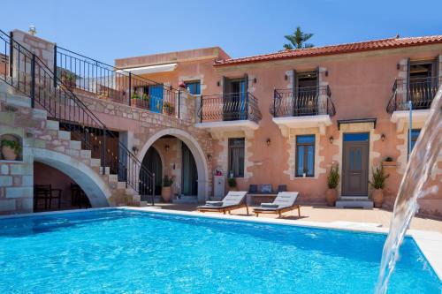 Tzitzifes Villa | Villa Kois - Authentic Stone Villa with Waterfall Pool by Posarelli Villas