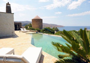 Stone built villa with a swimming pool and a fantastic sea view in Koundouros