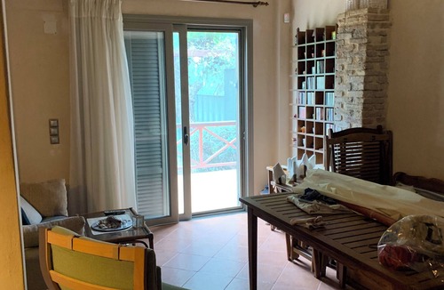Agii Anargiri Cottage | A cheerful cottage with a beautiful garden near the sea.