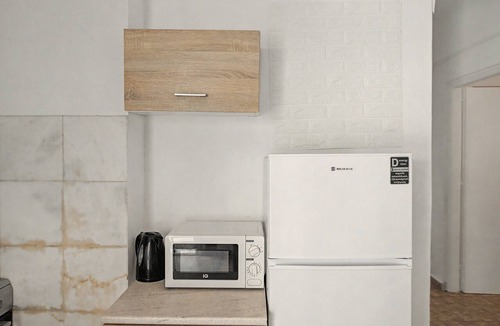 Perissa Apartment | Economy Quadruple Room 5 with Mountain View, Balcony, and Air Conditioning