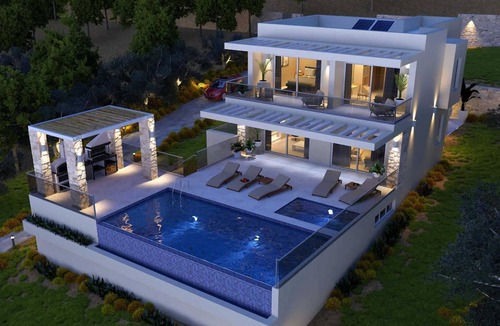 Agios Matthaios Villa | Luxury villa, coastal setting, sea views.