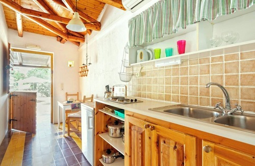 Vasilikos Cottage | Self catered Daphnes cottage #1 with large veranda and garden near the beach.