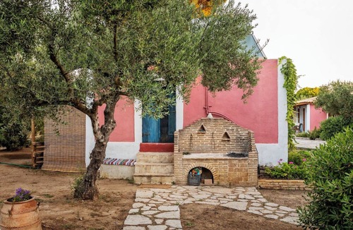 Vasilikos Cottage | Self catered Daphnes cottage #1 with large veranda and garden near the beach.