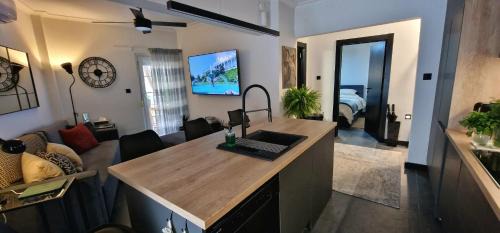 Old Town Apartment | Stylish Olive Tree Garden Apartment in Ano Poli