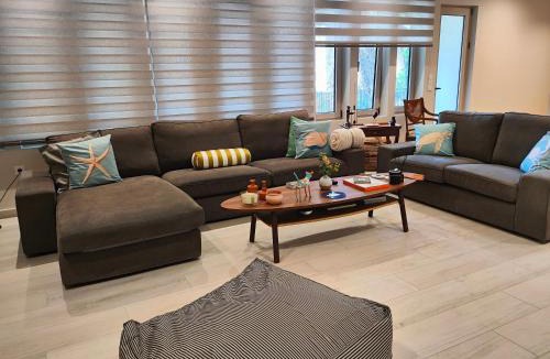 Vouliagmeni Apartment | THALIA, luxury 3Br Home with Ensuite Bathrooms, just 3 minutes walk from the beach located in the prestigious Athenian Riviera