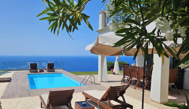 Private hillside villa with heated pool and magnificent views over Ionian Sea in HR8P+WW Sinarades