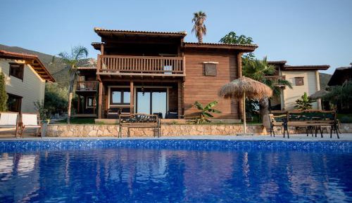 Τhe Stonewood Cottage - 2 Bedroom Poolfront Villa with Sea View, Sauna & Shared Pool