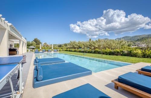 Almiros Beach Villa | Villa Serenissima - Beachfront Villa with Indoor & Outdoor Pools and Gym by Posarelli Villas